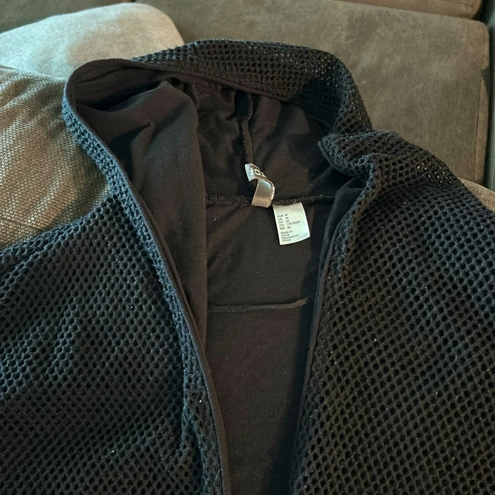 Long thick cardigan black with net on the outer layer used in great condition